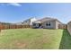 Large backyard with a patio, grassy area, and wooden fence at 182 Greenwich Dr, Summerville, SC 29486