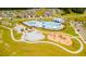 Community pool and playground with surrounding homes at 518 Golden Embers Way, Summerville, SC 29486