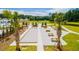 Bocce ball court with picnic tables and palm trees at 518 Golden Embers Way, Summerville, SC 29486