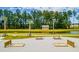 Horseshoe pit with picnic tables by a pond at 518 Golden Embers Way, Summerville, SC 29486