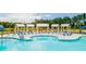 Relaxing pool area with multiple lounge chairs and cabanas at 518 Golden Embers Way, Summerville, SC 29486