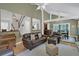 Spacious living room with leather furniture and a fireplace at 589 Oyster Rake Dr, Kiawah Island, SC 29455