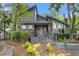 Gray house exterior with brick paver driveway and landscaping at 589 Oyster Rake Dr, Kiawah Island, SC 29455