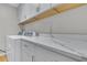 Laundry room with white cabinets and quartz countertop at 589 Oyster Rake Dr, Kiawah Island, SC 29455