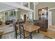 Dining area with wood table and chairs, adjacent to living room at 589 Oyster Rake Dr, Kiawah Island, SC 29455
