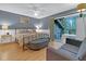 Bedroom with a metal bed frame, gray walls, and access to a deck at 589 Oyster Rake Dr, Kiawah Island, SC 29455
