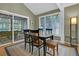 Bright dining area with sliding glass doors to screened porch at 589 Oyster Rake Dr, Kiawah Island, SC 29455