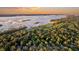 Aerial view of a community nestled near a golf course and waterway at 589 Oyster Rake Dr, Kiawah Island, SC 29455