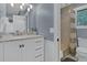 Bathroom with white vanity and hexagon tile shower at 589 Oyster Rake Dr, Kiawah Island, SC 29455