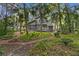 Spacious backyard with lush landscaping and a winding pathway at 589 Oyster Rake Dr, Kiawah Island, SC 29455