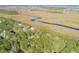 Aerial view of waterfront property with marsh and homes at 1713 Vireo Ct, Johns Island, SC 29455