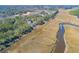 Aerial view of waterfront property with marsh and homes at 1713 Vireo Ct, Johns Island, SC 29455