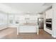 Modern kitchen with white cabinets, granite countertops, and stainless steel appliances at 112 Archdale St St, Summerville, SC 29486