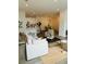 Open living room, kitchen, and dining area with hardwood floors and modern furniture at 420 Carolina Cherry Ct # 204, Charleston, SC 29414