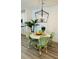 Bright dining area with round marble table and green chairs at 420 Carolina Cherry Ct # 204, Charleston, SC 29414
