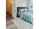 Cozy bedroom with a queen bed and access to a hallway bathroom at 420 Carolina Cherry Ct # 204, Charleston, SC 29414