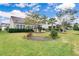 Landscaped backyard with lush lawn and mature trees at 462 Eastern Isle Ave, Summerville, SC 29486