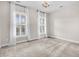 Bright bedroom with neutral walls, carpeting, and window with shutters at 462 Eastern Isle Ave, Summerville, SC 29486