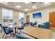 Bright and airy community room with multiple tables and chairs at 462 Eastern Isle Ave, Summerville, SC 29486