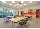 Bright community room with tables and chairs, perfect for gatherings at 462 Eastern Isle Ave, Summerville, SC 29486