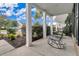 Covered front porch with rocking chairs and neighborhood view at 462 Eastern Isle Ave, Summerville, SC 29486