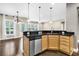 Modern kitchen with an island, stainless steel appliances and dark countertops at 462 Eastern Isle Ave, Summerville, SC 29486