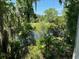 Peaceful water view from a home, showcasing lush greenery and Spanish moss at 420 Carolina Cherry Ct # 202, Charleston, SC 29414