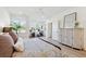 Spacious bedroom with a bed, sitting area, and ample natural light at 420 Carolina Cherry Ct # 202, Charleston, SC 29414
