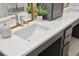 White quartz countertop with undermount sinks and dark grey cabinets at 420 Carolina Cherry Ct # 202, Charleston, SC 29414