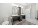 Bathroom boasts double vanity, grey cabinets, and a stylish rug at 420 Carolina Cherry Ct # 202, Charleston, SC 29414