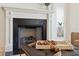 Modern fireplace with white mantel and black interior at 420 Carolina Cherry Ct # 202, Charleston, SC 29414