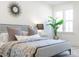 Serene bedroom with a stylish bed, large window, and a plant at 420 Carolina Cherry Ct # 202, Charleston, SC 29414