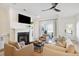 Relaxing living room featuring a fireplace and ample natural light at 420 Carolina Cherry Ct # 202, Charleston, SC 29414