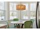 Charming kitchen nook with a marble table, green chairs, and large windows at 420 Carolina Cherry Ct # 202, Charleston, SC 29414