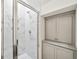 Bathroom with marble shower, built-in storage, and modern fixtures at 420 Carolina Cherry Ct # 202, Charleston, SC 29414