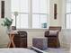 Relaxing sitting area with wicker chairs and ottoman, offering natural light at 420 Carolina Cherry Ct # 202, Charleston, SC 29414