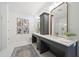 Elegant bathroom with double vanity, large mirrors, and a frameless shower at 420 Carolina Cherry Ct # 202, Charleston, SC 29414