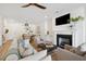 Bright living room with fireplace, hardwood floors, and comfortable seating at 420 Carolina Cherry Ct # 202, Charleston, SC 29414