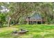 A-frame home on stilts with a large deck at 2951 Roseville Rd, Wadmalaw Island, SC 29487