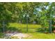 Elegant metal gate opens to a private area at 2951 Roseville Rd, Wadmalaw Island, SC 29487