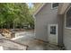 View of backyard with patio, detached garage, and surrounding trees at 200 Old Postern Rd, Summerville, SC 29483