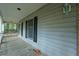 Covered front porch with wooden floors and white railings at 200 Old Postern Rd, Summerville, SC 29483