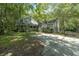 Two-story house with attached garage, surrounded by lush greenery at 200 Old Postern Rd, Summerville, SC 29483