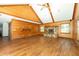 Vaulted ceiling living room with wood walls and flooring at 200 Old Postern Rd, Summerville, SC 29483