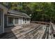 Large wooden deck with damaged boards and surrounding trees at 200 Old Postern Rd, Summerville, SC 29483