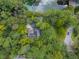 House surrounded by trees near a pond at 200 Old Postern Rd, Summerville, SC 29483