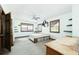 Empty bedroom with two windows, ceiling fan, and simple wooden platform bed frame at 200 Old Postern Rd, Summerville, SC 29483