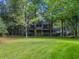 Two-story house with wrap-around porch and a large green lawn at 200 Old Postern Rd, Summerville, SC 29483