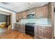 Kitchen features wood cabinets, laminate countertops, and a stove at 200 Old Postern Rd, Summerville, SC 29483