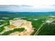 Aerial view of new community near construction zone, ponds, and green spaces with easy access to highway and commercial development at 281 Blue Haw Dr, Moncks Corner, SC 29461